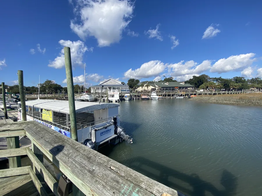 The creek at Murrells Inlet with small boats moored and houses along the bank